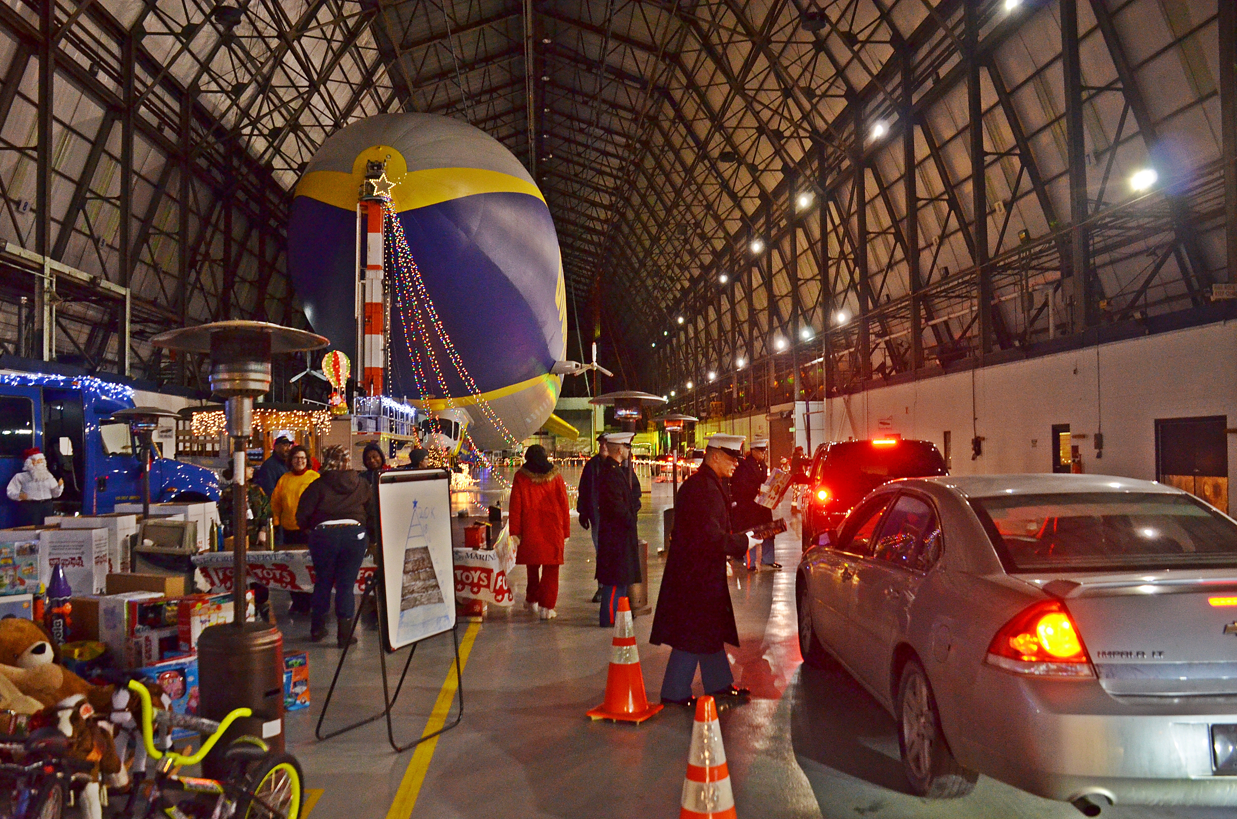 Collecting Toys 4 Tots at Goodyear blimp hanger